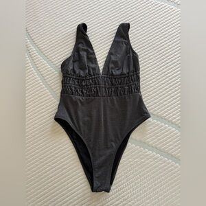 Sleek Black One-Piece Swimsuit with Ruched Waist